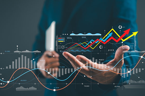 Un profesional que analiza tendencias de datos con las manos levantadas, mostrando gráficos y cuadros vibrantes que indican crecimiento y análisis.